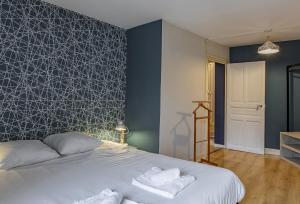 Posteľ alebo postele v izbe v ubytovaní L'Octroi, maison au cœur de St Dyé sur Loire