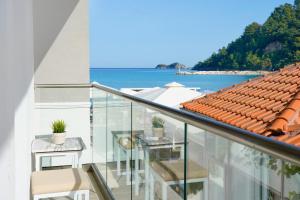 a balcony with a view of the ocean at Ester Luxury Rooms in Skala Potamias