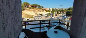 a balcony with a view of a parking lot at Mıstık Otel in Cesme