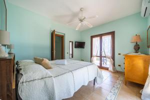 Кровать или кровати в номере Villa Rosa sul mare