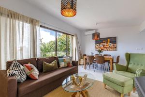 a living room with a couch and a table at Villa Los Pinos 6 in Altea