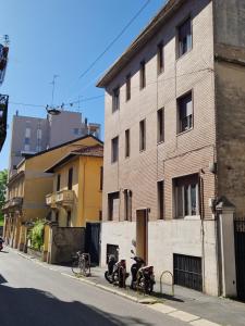 a group of motorcycles parked next to a building at Studio Luna Apartments in Milan