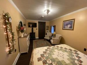 a bedroom with a christmas tree in a room at The Swope Manor Bed & Breakfast in Gettysburg