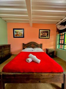 Postel nebo postele na pokoji v ubytování Finca Hotel Guayacundo