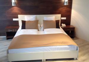 Cama o camas de una habitación en Hotel Median Hajdúnánás