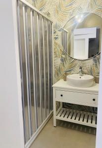 a bathroom with a sink and a mirror at Bell'Arè in Barletta +16 photos