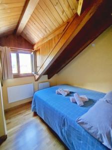 Postel nebo postele na pokoji v ubytování Apartaments Sort Pirineus