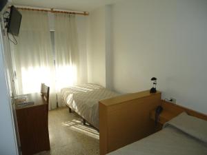 Postel nebo postele na pokoji v ubytování Residència Restaurant Indalo