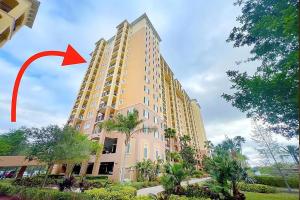 a tall building with a red arrow on it at Spider-Man-themed condo near Disney, Sea World, Universal and OCCC with pool, spa, restaurants, shuttle, private balcony, and view of fireworks shows in Orlando