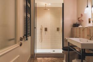 a bathroom with a shower and a sink at No 42 by GuestHouse, Margate in Margate
