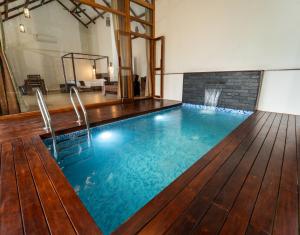 a swimming pool in the middle of a room at Coffee and Pepper Plantation Homestay in Thekkady