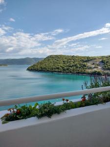 a view of a lake from a balcony at Family Majčica - villa Malo Misto in Klek