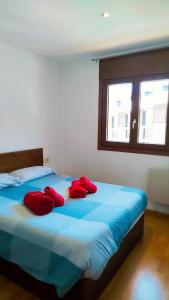 Ein Bett oder Betten in einem Zimmer der Unterkunft Apartaments Sort Pirineus
