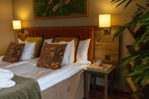 Säng eller sängar i ett rum på Villa Foresta