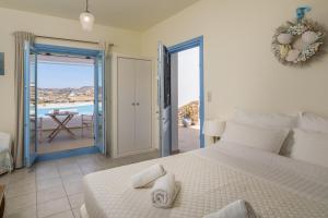 Posteľ alebo postele v izbe v ubytovaní Blu Suites and Studios + 37 fotografií