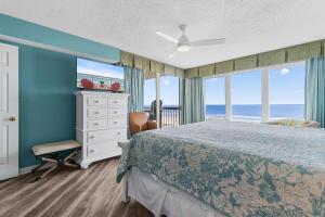 a bedroom with a bed and a view of the ocean at Beachfront Oasis at Litchfield By the Sea: 3 Bdrm in Pawleys Island +27 photos
