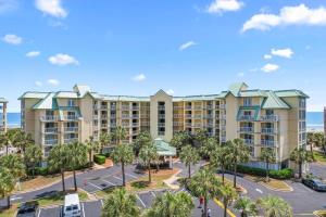an aerial view of a resort with palm trees at Beachfront Oasis at Litchfield By the Sea: 3 Bdrm in Pawleys Island