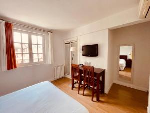 TV a/nebo společenská místnost v ubytování Hotel Palacete