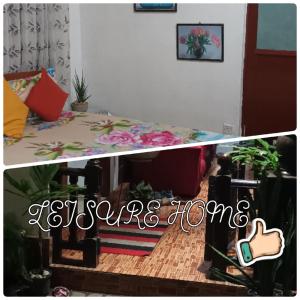 uma sala de estar com uma mesa e um quarto com uma casa em Leisure home em Colombo
