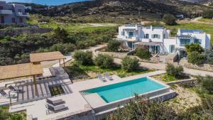 an aerial view of a house with a swimming pool at Avrofilito Syros Houses in Ermoupoli
