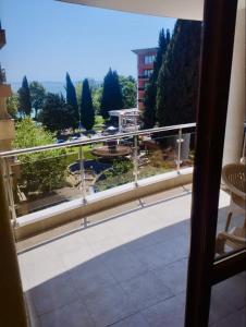 a balcony with a view of a parking lot at Julia Vigo Panorama apartments in Nesebar