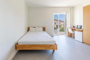 Giường trong phòng chung tại StudentVille Academia +33 ảnh