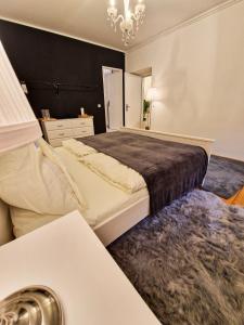 En eller flere senge i et værelse på Apartment Alois