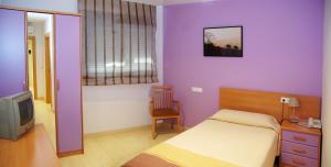 Ein Bett oder Betten in einem Zimmer der Unterkunft Hotel Restaurante Caracho