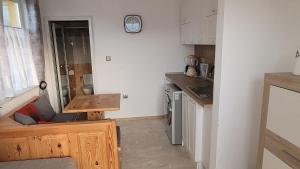 A kitchen or kitchenette at Strumyani tiny flat