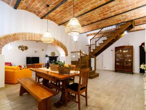 a large living room with a wooden table and chairs at Siena Podere Rural Chic W Private Garden & Parking in Siena