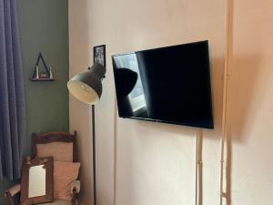 a flat screen tv hanging on a wall at Premium Dighbeth in Birmingham
