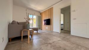 a living room with a couch and a table at Apartment Città di Mare in Cesenatico