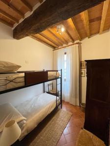Postel nebo postele na pokoji v ubytování Casetta Marilà + 6 fotografií