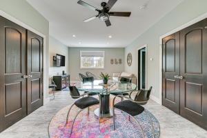 a dining room with a glass table and chairs at Fire Pit and Beach Access Quiet Northville Retreat in Benson
