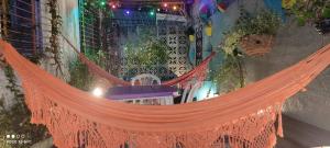 an orange hammock hanging from the side of a building at Hostel e Pousada Boa Vista in Recife