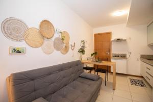 a living room with a couch and a table at Hotel Life Resort Brasília - Ozped Flats in Brasilia