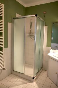 a glass shower in a bathroom with a sink at Villa Cardinala - Ravenna in Gambellaro