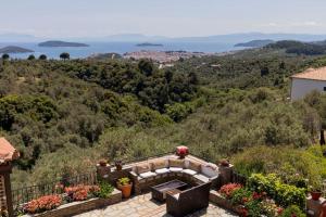 a villa with a view of the ocean at Koukounaraki Apartment 1 in Skiathos