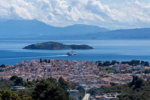 a cruise ship in a large body of water at Koukounaraki Apartment 1 in Skiathos