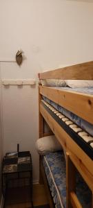 a pair of bunk beds in a room at Appartement montagne in Superbagnères