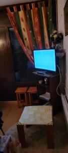 a desk with a laptop computer on top of it at Appartement montagne in Superbagnères