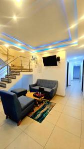 a living room with a couch and a table at ANAJIRAWAA HOTEL in Ríohacha