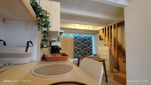a kitchen with a table and chairs in a room at Alle volte Suite 30 in Grumo Appula