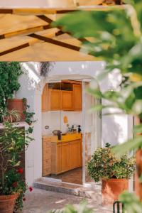 a kitchen with wooden cabinets and a counter top at 23Baci, Capri in Capri