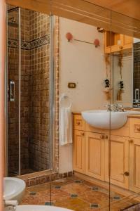 a bathroom with a sink and a shower at 23Baci, Capri in Capri