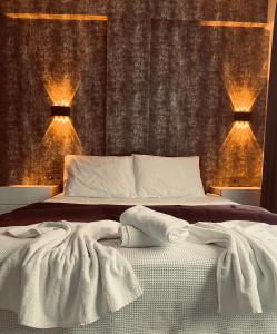 a bedroom with a bed with two lights on it at Alanya My Boutique Hotel in Alanya