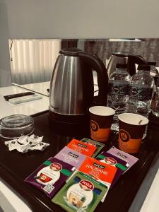a counter top with a coffee pot and some drinks at Alanya My Boutique Hotel in Alanya