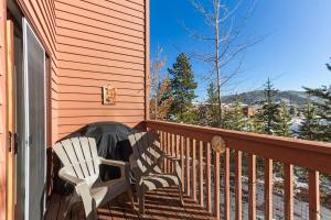 a pair of chairs sitting on a porch at Lagoon 723D by Great Western Lodging in Frisco