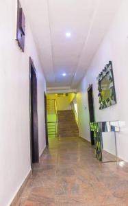a hallway with a staircase in a building at Dino international Hotel in Ibadan
