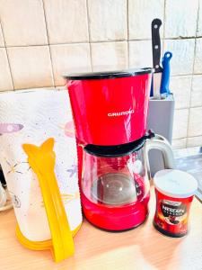 a red blender sitting on top of a counter at Dalmatian House, spacious stone terraces, balcony , views in Dubrovnik +291 photos
